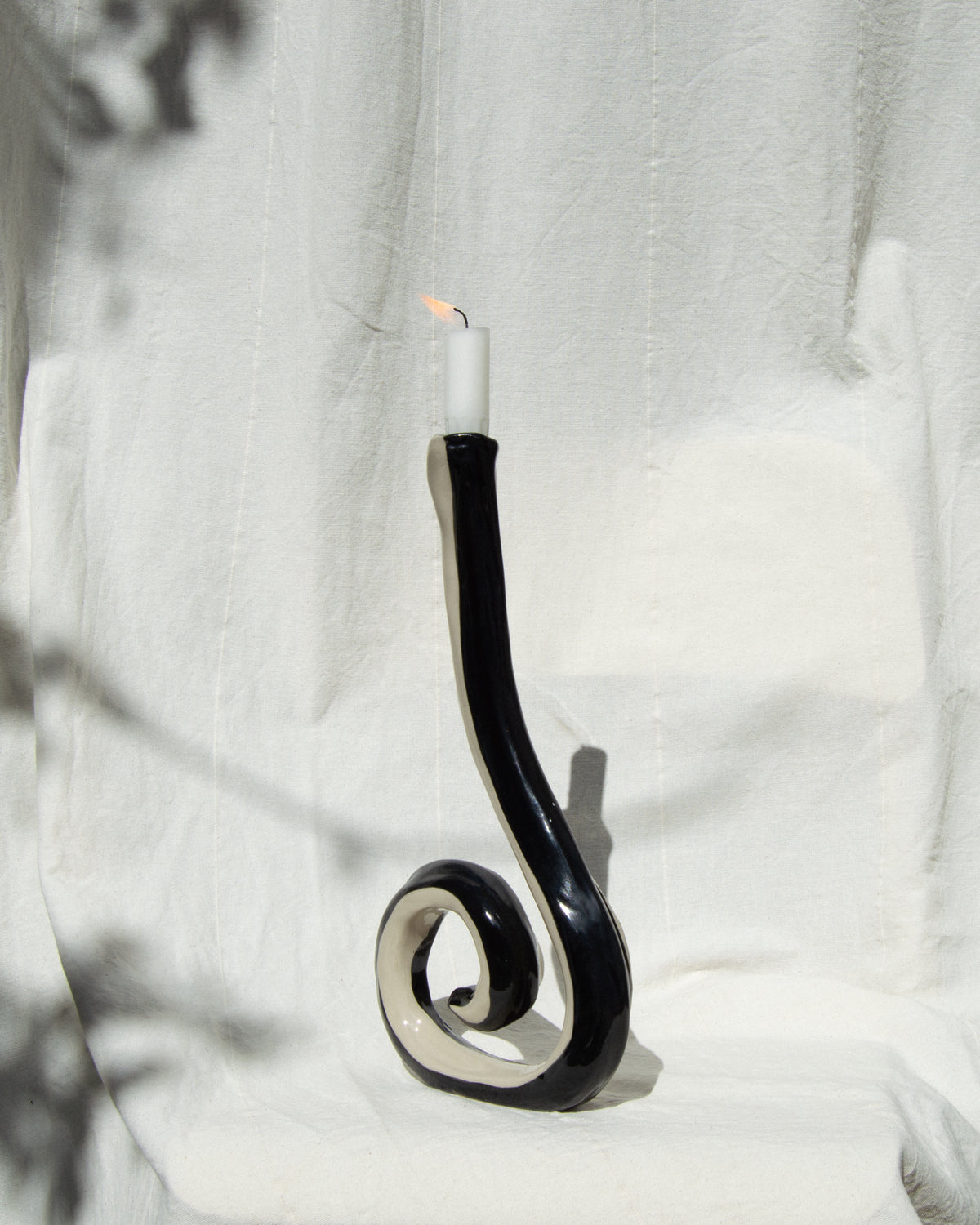 Candle holder – hand-painted black and off-white stoneware candleholder and vase