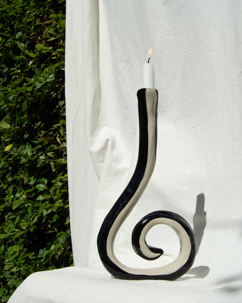 Candle holder – hand-painted black and off-white stoneware candleholder and vase