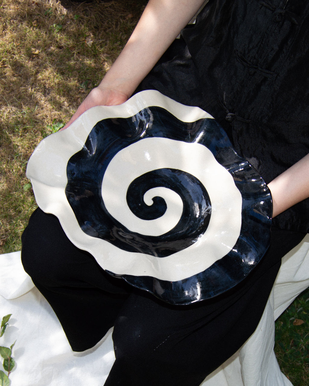 Spiral plate – hand-built stoneware serving plate with a black and off-white spiral