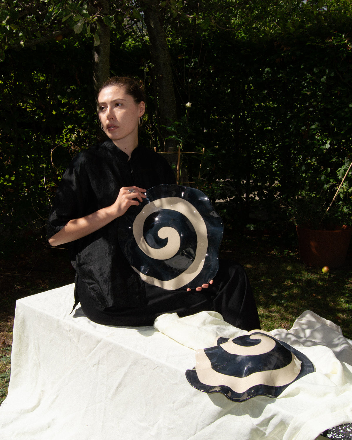 Spiral wave – hand-built stoneware sculpture with a black and off-white spiral glaze