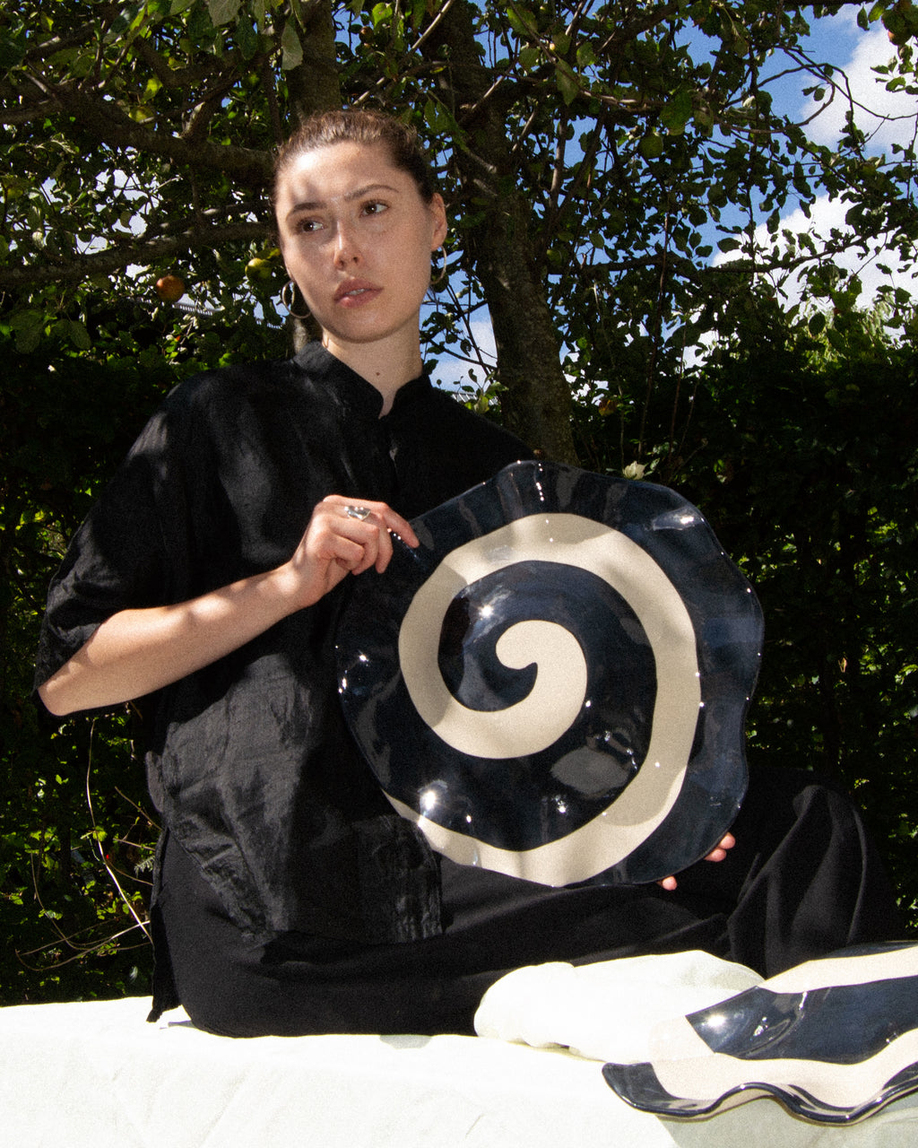 Spiral wave – hand-built stoneware sculpture with a black and off-white spiral glaze