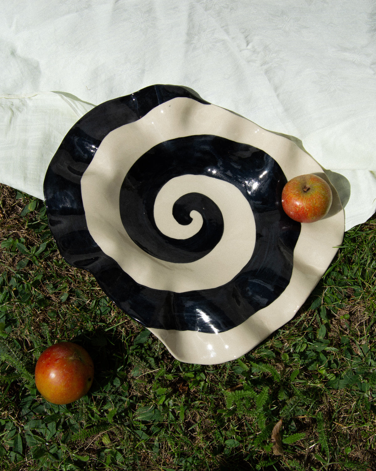 Spiral plate – hand-built stoneware serving plate with a black and off-white spiral