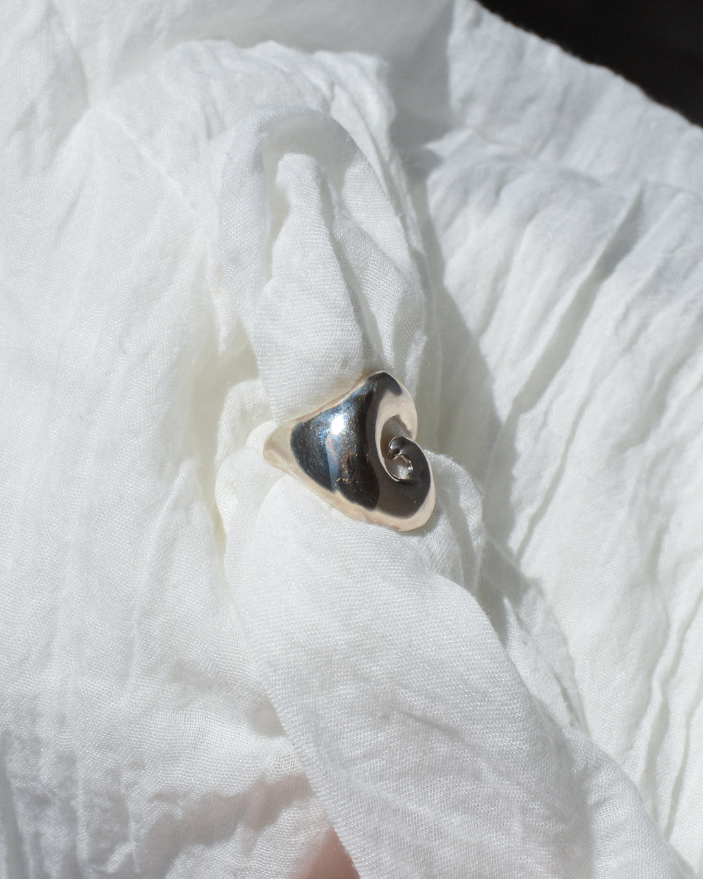 Abyss ring – hand-sculpted spiral ring in high-polish sterling silver
