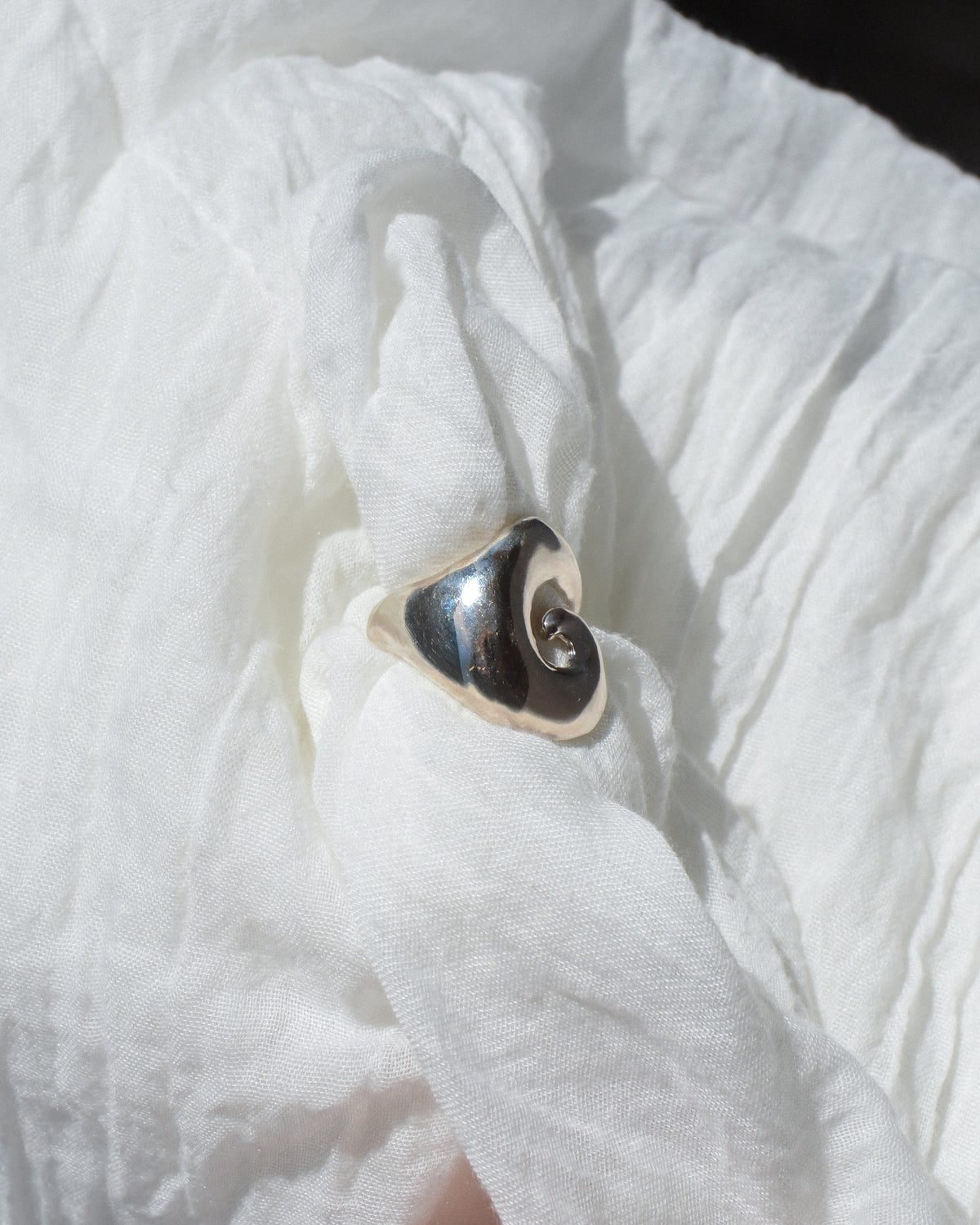 Abyss ring – hand-sculpted spiral ring in high-polish sterling silver