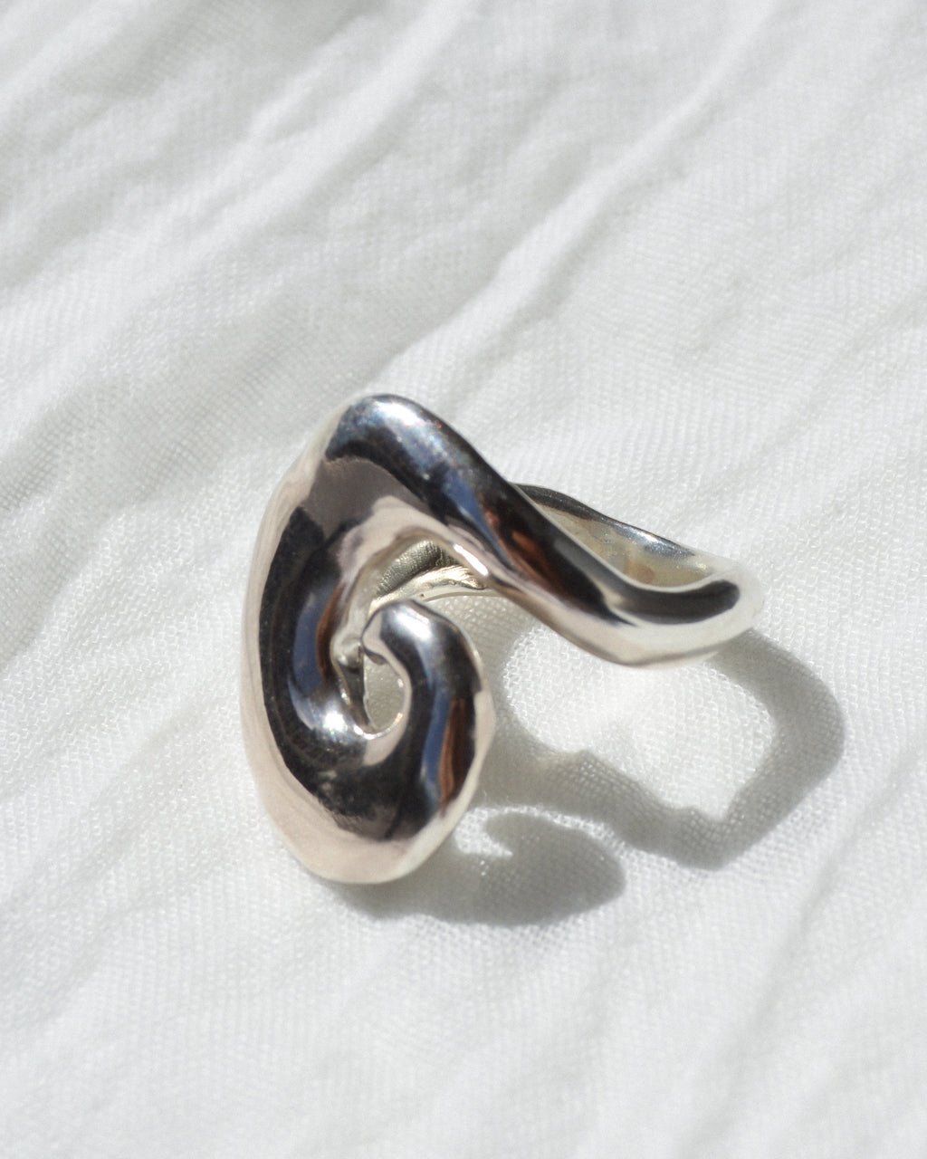 Abyss ring – hand-sculpted spiral ring in high-polish sterling silver