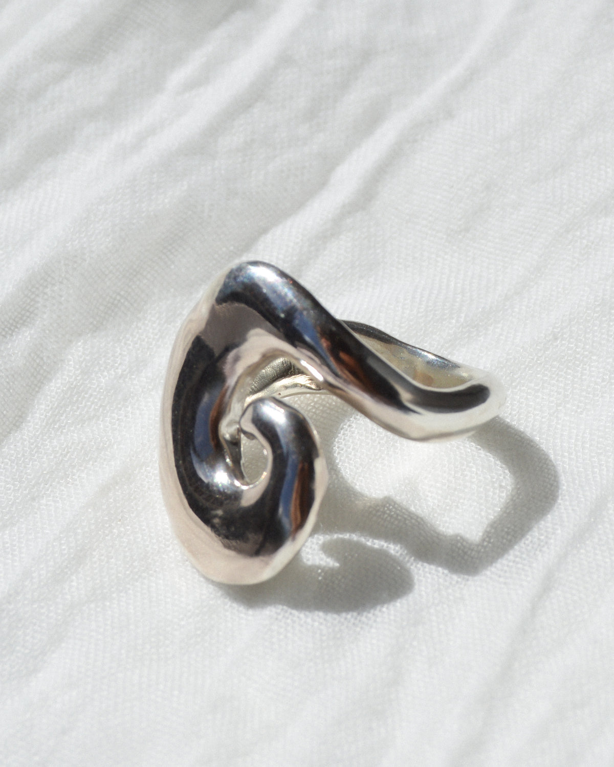 Abyss ring – hand-sculpted spiral ring in high-polish sterling silver