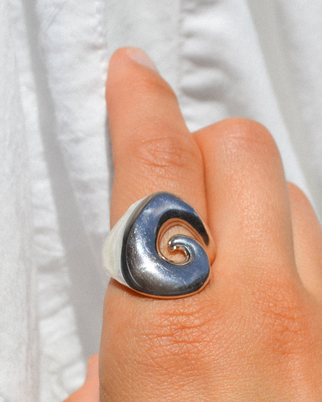 Abyss ring – hand-sculpted spiral ring in high-polish sterling silver