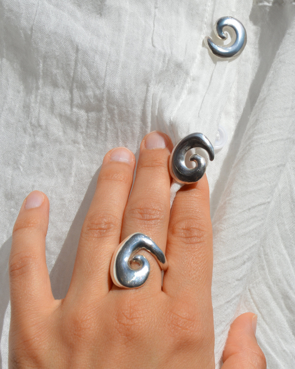 Abyss ring – hand-sculpted spiral ring in high-polish sterling silver