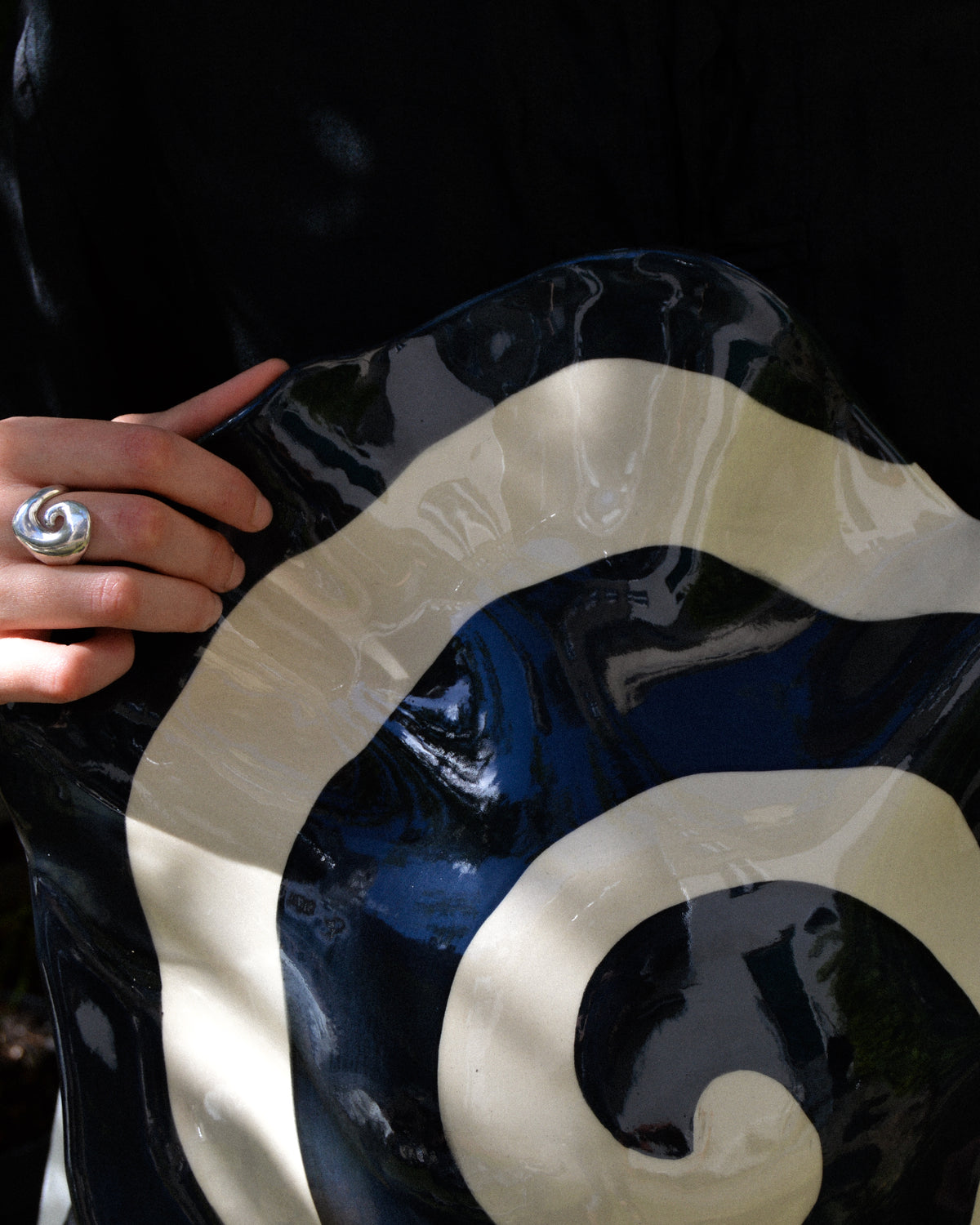 Spiral nautilus – glossy hand-painted stoneware wall piece with a spiral motif