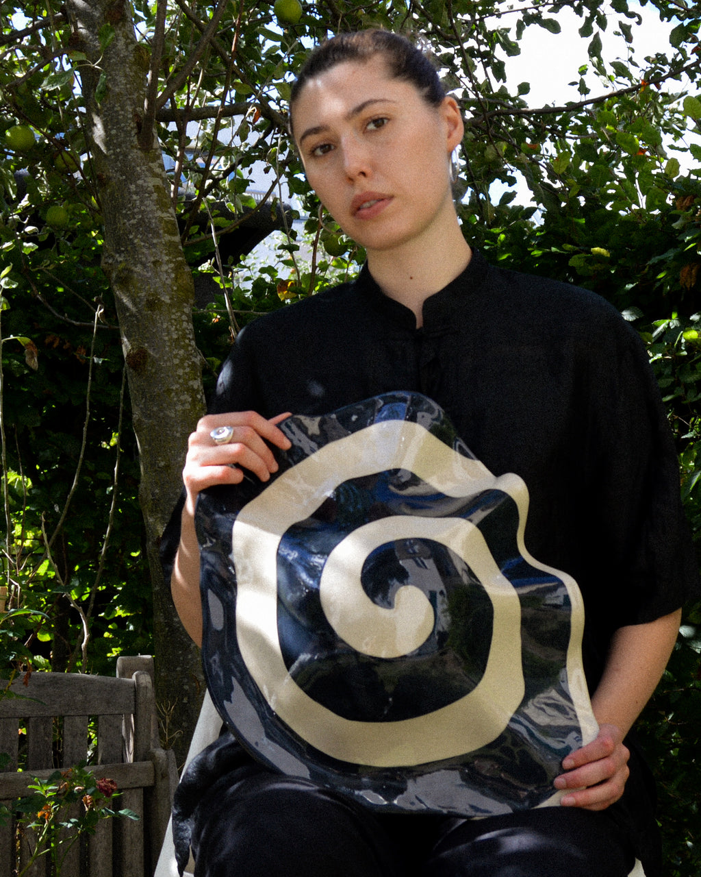 Spiral nautilus – glossy hand-painted stoneware wall piece with a spiral motif