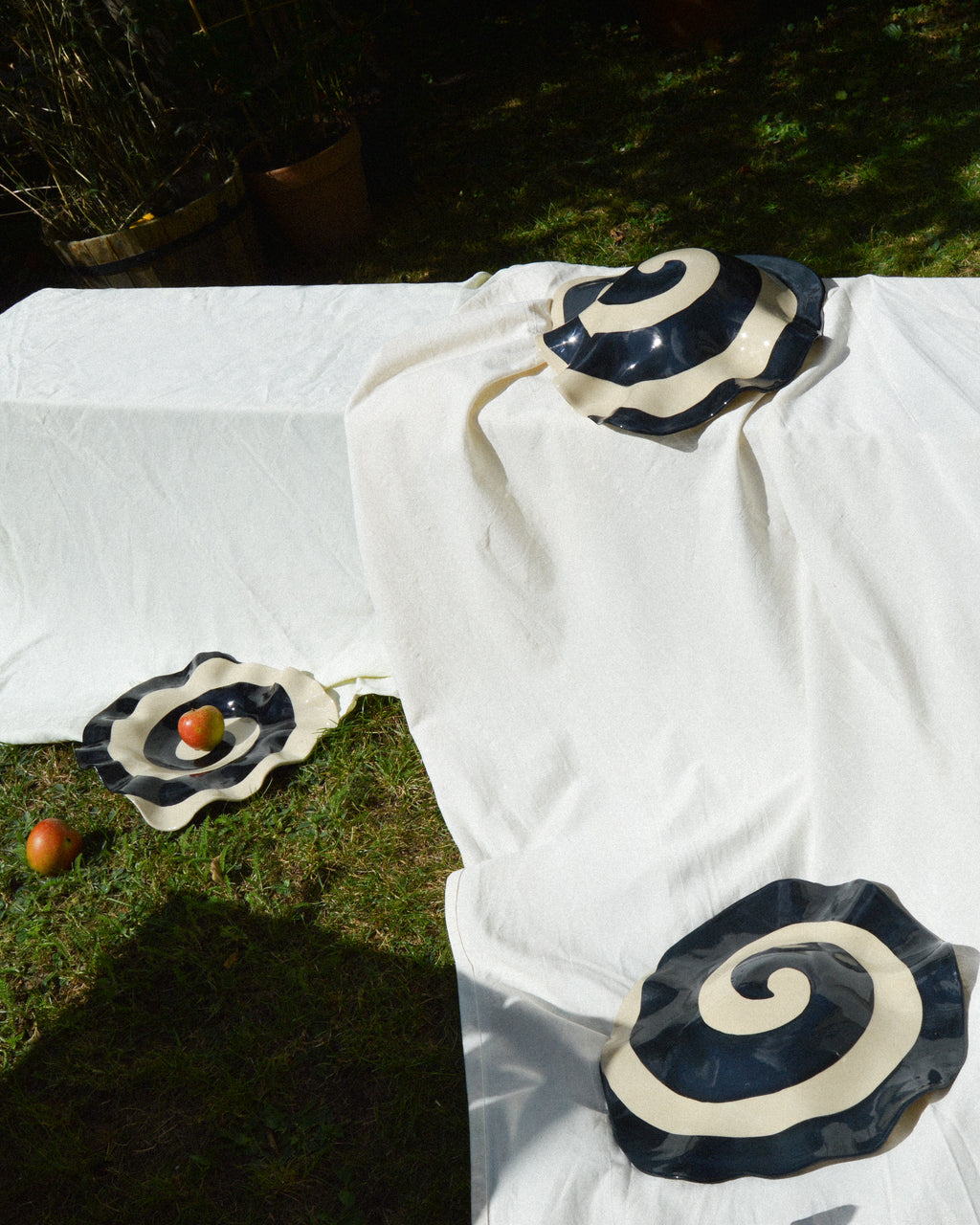 Spiral nautilus – glossy hand-painted stoneware wall piece with a spiral motif